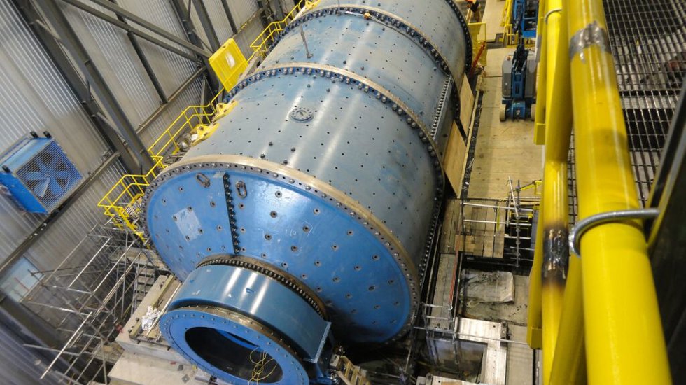 A 22-foot ball mill being assembled with bolts.