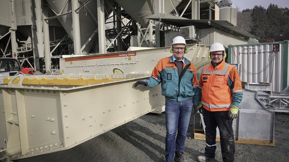 Two men posing next to CVB screen at Jost’s diabase quarry.