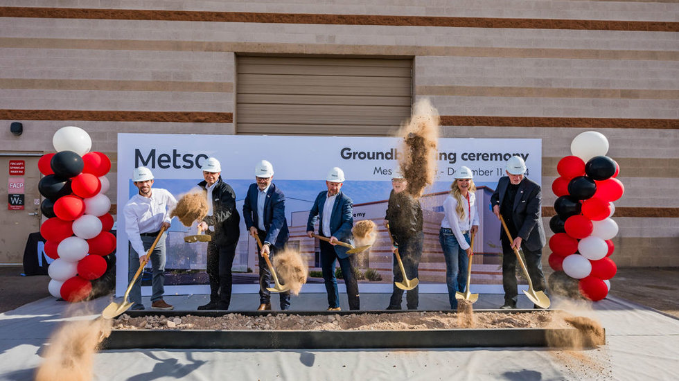 7 people shoveling dirt at a groundbreaking ceremony