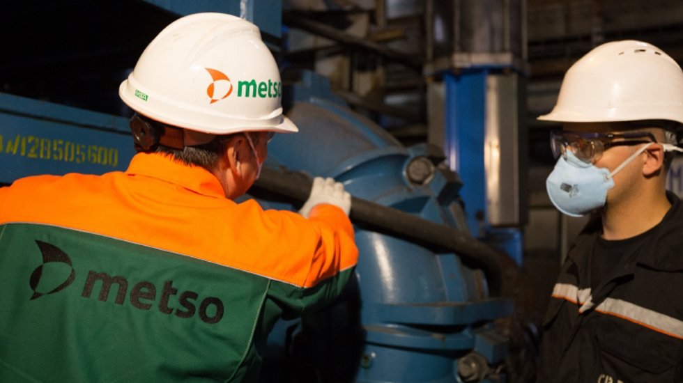 Mining experts inspecting a mill pump
