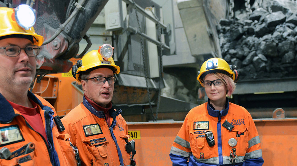 Three people at Outkumpu mine site. 