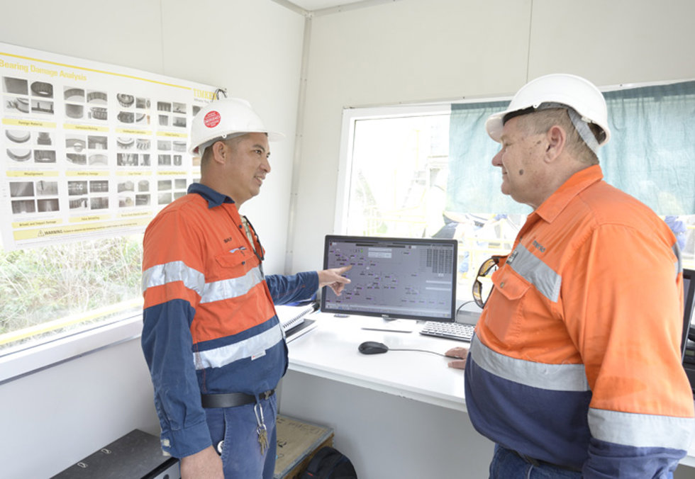 Two people talking in a control room at Monier’s Nebiri quarry.