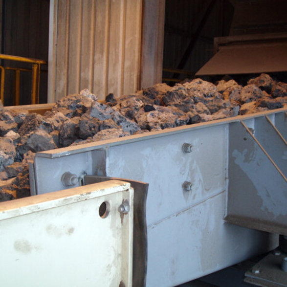 What makes slag different from natural rock?