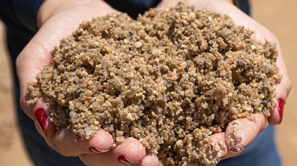 Sand held in hands.