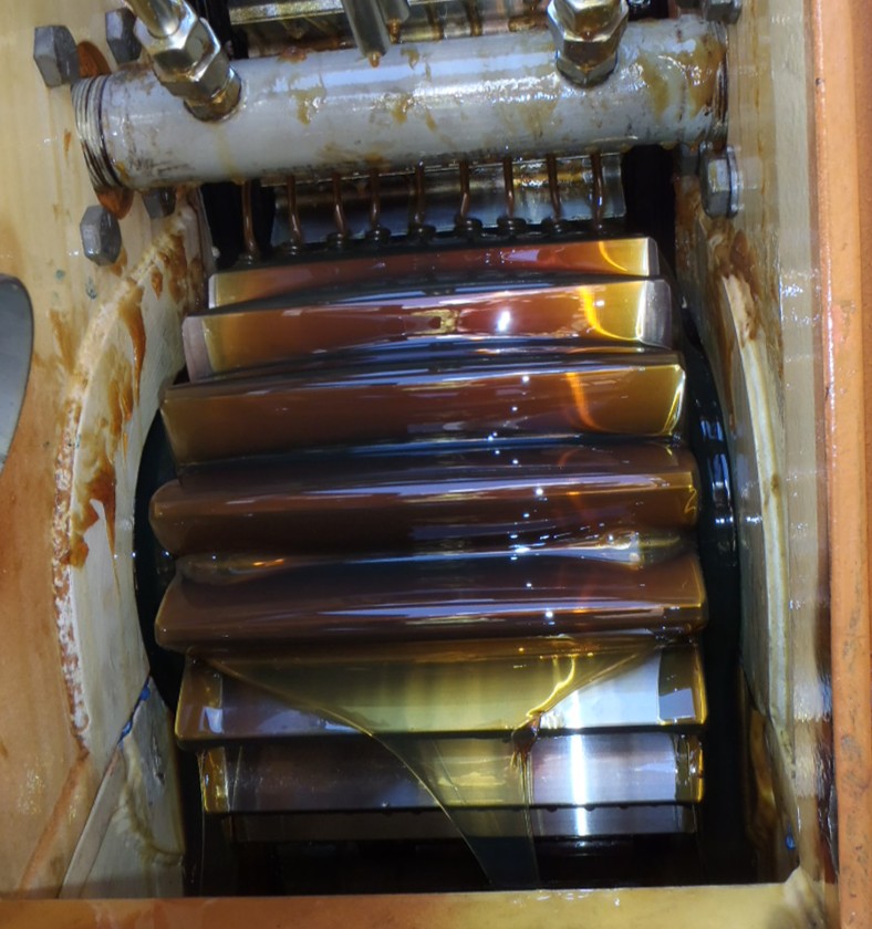 Example of a pinion in excellent condition using a modern thick oil lubricant in a dribble bar application.