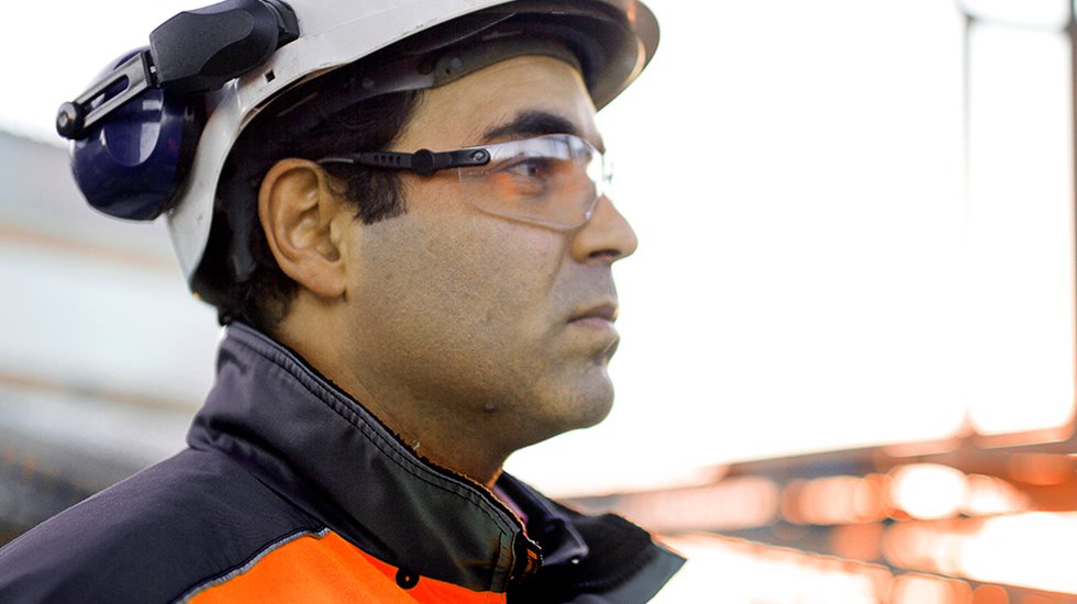 A close up of a person at a mining site.