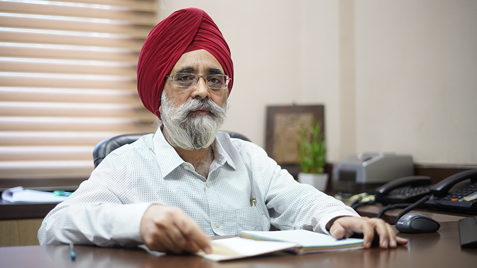 Mr. Manjeet Chawla, Director, Aman Sethi Group, pictured in an office. 