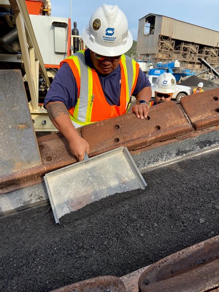 Jonathan Esperanza is checking the gradation of the concrete sand.