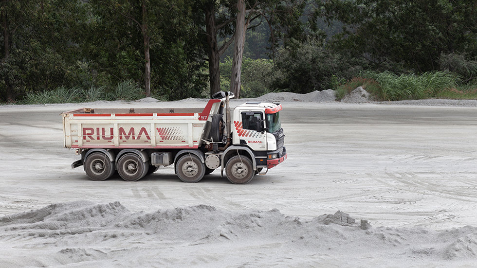 Riuma truck driving at the quarry. 
