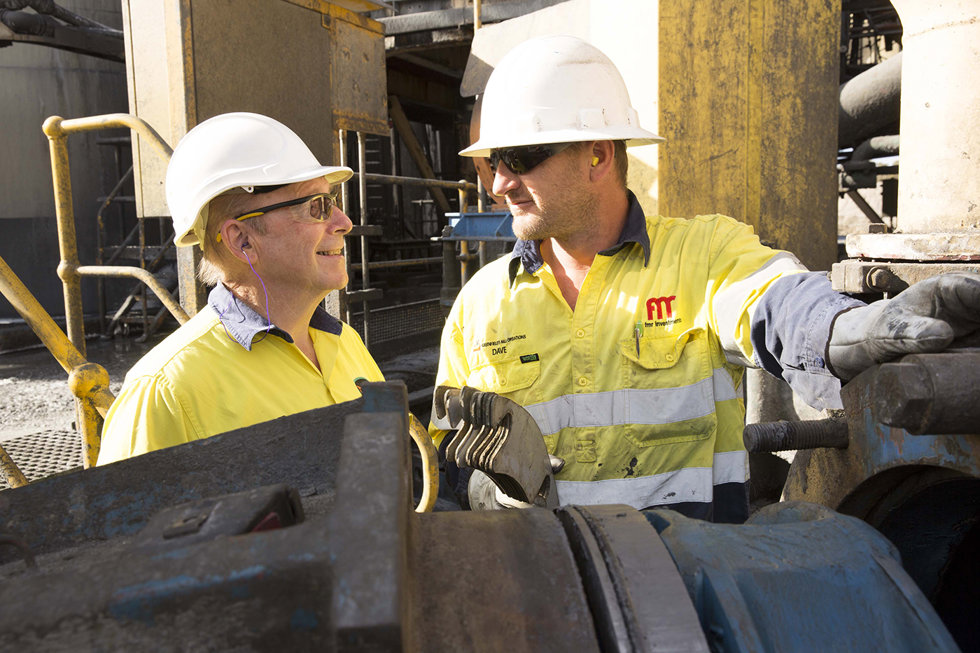Two employees discussing at Greenfields Mill's mine.